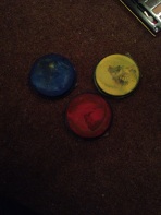 blue, yellow, red, black and white face paint.